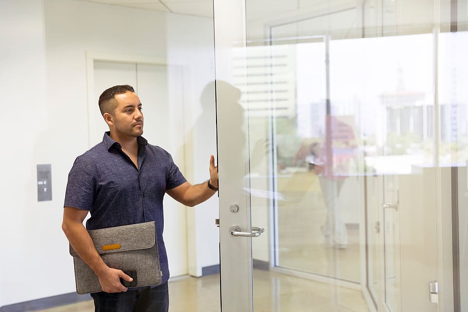 man-entering-conference-office-desk-people man-entering-conference-office-desk-people